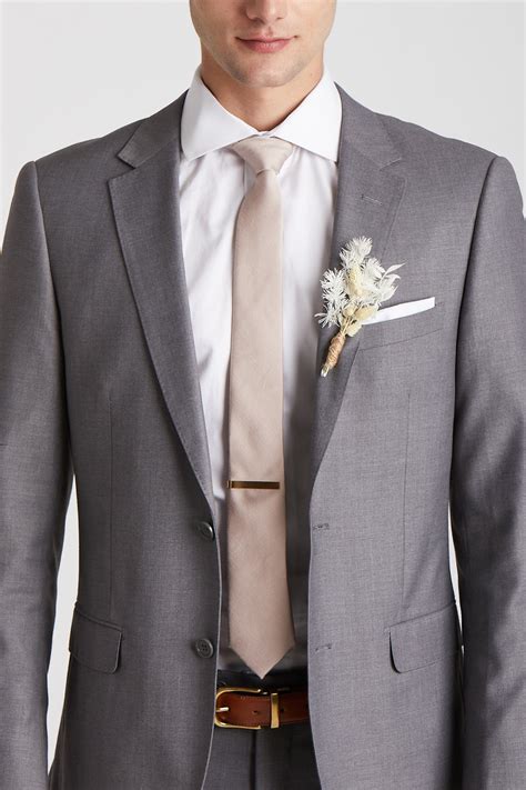 dark grey suit with champagne tie